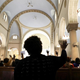 Marianne, the subject of a Boston Globe story, attends Mass in Mattapan, Mass. She works 40 hours a week and sends $50 to her eldest son back in Haiti. (Pat Greenhouse/Boston Globe)